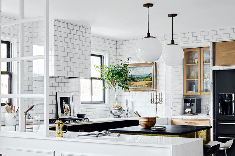 This glam black and white kitchen balances family practicality